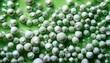 © Cristina - close up view of an abstract image featuring numerous off white spheres seemingly suspended within a translucent light green liquid