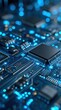 © Stocksy - Close up of glowing blue circuit board with central microchip.