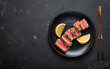 © somegirl - Seared grilled tuna steak tataki slices sesame seeds lemon black plate healthy delicacy space for