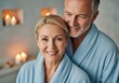 © Meow Creations - Smiling mature couple enjoying tranquil spa day in blue bathrobes