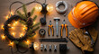 © Yulia - Professional Christmas light installation service tools on wooden surface, featuring safety helmet, glowing string lights, pine branches, and pliers
