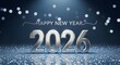 © Mashrafi - Happy new year 2026 silver 3d text on shimmering blue glitter and bokeh background celebration