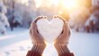 © EnelEva - Red heart shape in snow, a romantic winter symbol of love and Valentine's Day celebration