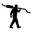 © HasanAkhter - Silhouette of a mechanic carrying an exhaust pipe symbolizes automotive repair expertise