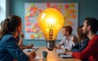 © Alexander - Ideation, brainstorming to gather new idea, effective meeting discussion, team members discover solution, scrum concept, business people brainstorm with sticky notes combined to bright lightbulb idea.