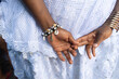© Thales - Hands and Cowrie Shell Bracelet of a Bahian Woman in White Lace Dress during celebrations for Bahian Womans Day. Salvador, Bahia.