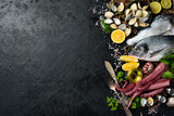 Fresh seafood, shellfish, crustaceans and fish. Background of marine food. Top view.