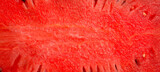 Watermelon texture, macro photo, close-up. Piece of watermelon with seeds. Top view.