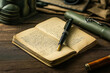 © Rattanapon - Vintage Soldier Journal from 1944 Open with Fountain Pen on Wooden Desk