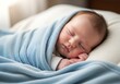 © keb - Sleeping newborn baby wrapped in a soft blue blanket on a pillow