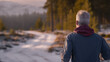© SlotPoM - Man Walking on Snowy Path in Winter Forest at Sunset