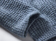 © Connect Images - Close-up of soft blue textured fabric with a waffle pattern.