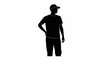 © Handik - Silhouette of a man wearing a cap and t-shirt, standing with hand on hip.