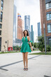 © Andrey_Arkusha - Young beautiful brunette woman in a green polka dot dress