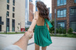 © Andrey_Arkusha - Follow me. Young woman holding a mans hand. Travel with me