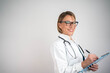 © Nenad - Mature female doctor on light background