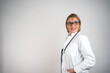 © Nenad - Mature doctor woman over isolated background laughing
