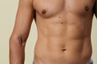 © skeronov - A close-up of a slender young man's torso. Male body parts: defined abs and toned chest. Scene: a doctor's appointment in an X-ray room. moles and birthmarks on the body