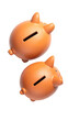 © Abzr - Two piggy banks stacked, orange color, angled view