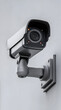 © sornram - Close-up of a modern security camera mounted on the wall, emphasizing surveillance technology and safety measures in urban environments.