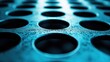 © zalfa_std98 - Close-up of a metal plate with many circular holes, in a cool blue tone