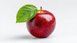 © Sabana - A vibrant red apple with a green leaf resting on a white surface in close up view