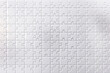 © bluecreamy - Minimal white puzzle background with complete interlocking pieces in a smooth clean pattern surface