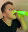 © schankz - A boy warms his nose with a lamp in a hospital. A procedure to remove germs from the nose