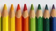 © Anastasiia - A row of sharpened colored pencils arranged in a rainbow from yellow to purple. Concept Colorful pencils in rainbow order, Sharp pencils still life, Art supplies close-up, Yellow to purple spectrum