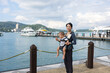 © leungchopan - Mother and baby enjoying scenic Sun Moon Lake view