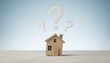 © Husen - A small wooden house model with three white question marks floating above it, symbolizing housing uncertainty.