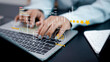 © Thawatchai Images - Customer Review and 5-Star Rating Analytics on Laptop
