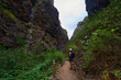© Xalanx - Hiker in dramatic narrow canyon