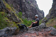 © Xalanx - Hiker resting in volcanic canyon