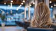© Maksym - Close-up of long blonde hair under salon lights, modern styling chair and sleek mirrors in soft focus, professional beauty photography style