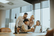 © BGStock72 - Team collaboration and discussion in a modern office setting during business hours