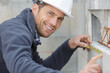 © auremar - happy male builder looking at camera