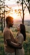 © Yauhen - Happy interracial couple looking at each other in field during sunset. Romantic date outdoors ideal for relationship concepts.