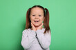 © New Africa - Portrait of cute little girl on green background