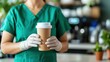 © Design Depot - Surgeon prepares for a busy day in the operating room with coffee in hand