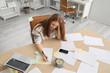 © Pixel-Shot - Stressed young businesswoman working under deadline in office