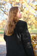 © Yevhen - Portrait of a young woman in sunny autumn park. Back view