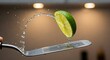 © MdKaziNazrul - Dynamic water splash from vibrant lime half onto a kitchen spatula