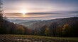 © Imam - Autumnal sunrise over rolling hills and vibrant forests scenic landscape