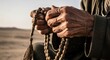 © Vladislav - Elderly person's weathered and wrinkled hands holding traditional wooden prayer beads in a gesture of faith and spiritual devotion during a quiet moment of meditation