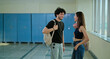 © Raushan_films - Indian happy young adult gen z girl meet boy guy spend break time at college campus place. Smart male man lady female wear bag talk share new plan gossip enjoy day hallway