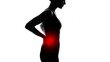 © shafiq - Silhouette of a woman with back pain highlighted in red against a white background in a profile view