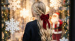 © Shuvojit11 - Woman with red bow looking at christmas window display