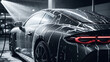 © Abdul Latif - Dark luxury car being washed with soap and water spray car wash automobile