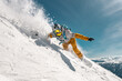 © cppzone - Fast man snowboarder rides in cloud of powder snow outside ski slope. Backcountry or offpiste free riding at ski resort